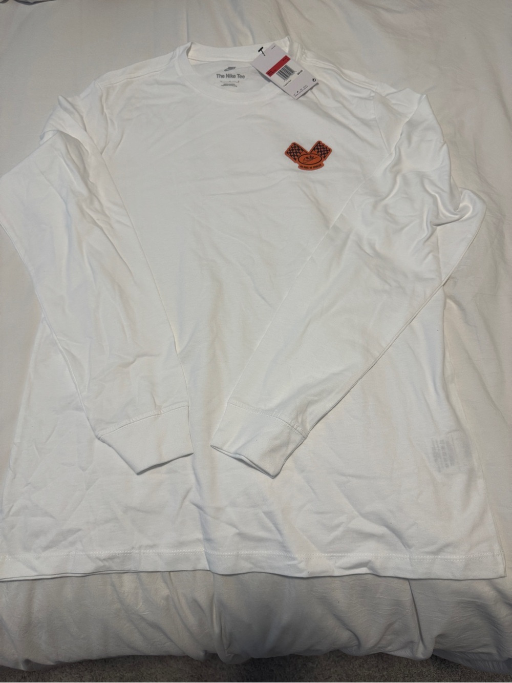 Nike Men's White Long-Sleeve Crew Tee with Embroidered Chest Patch